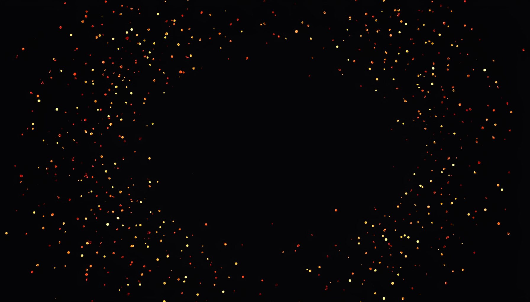 Abstract dark background with scattered gold and orange sparkling particles, moody and festive